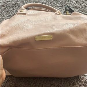 Pink satchel styled purse with tassels